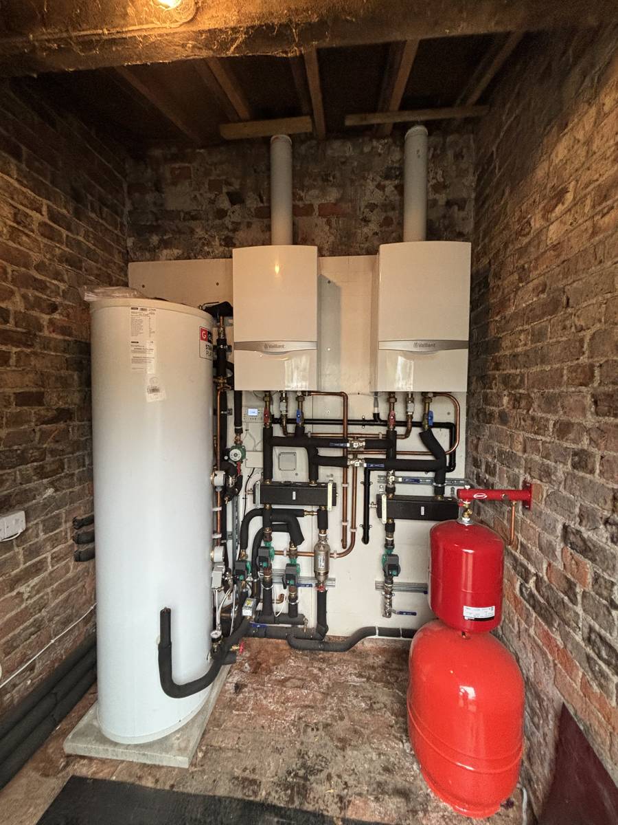Twin Vaillant boilers — brick outbuilding