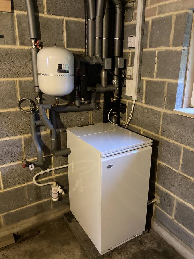 Oil boiler with insulated pipework